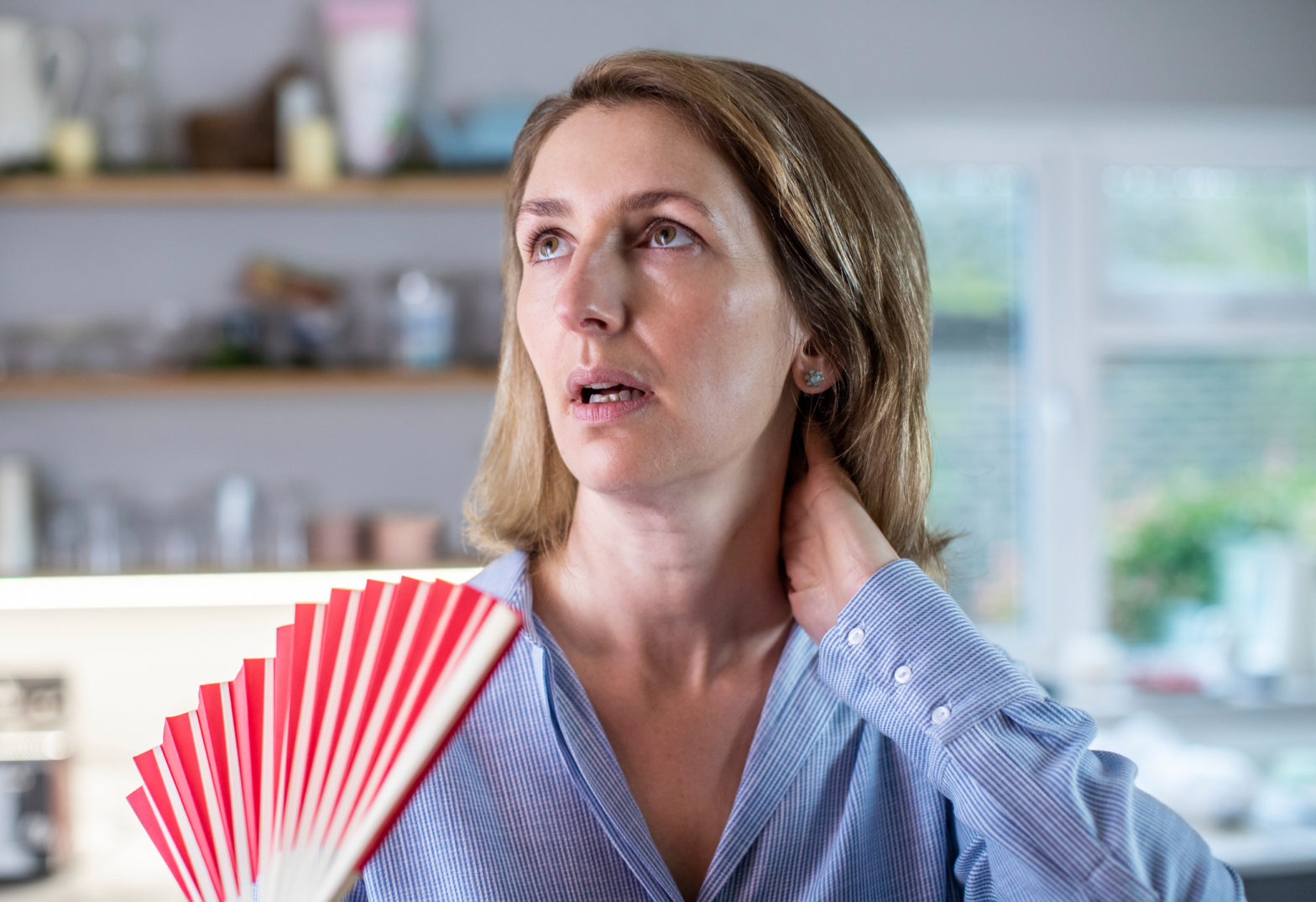 Women Experiencing Menopause Hot Flash